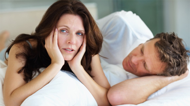 Unhappy female having problems in bed with husband