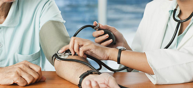 Doctor checking blood pressure to patient