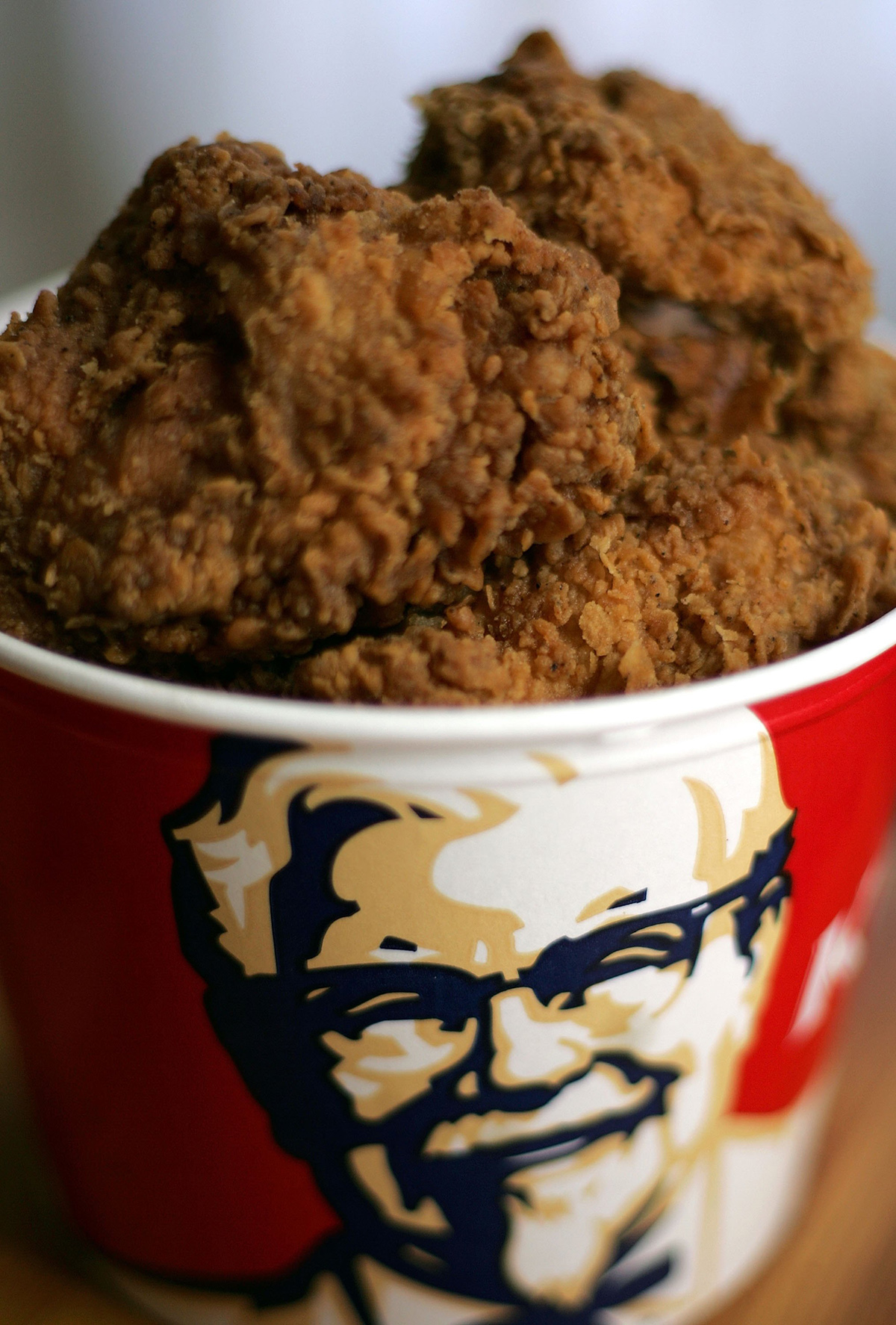 SAN RAFAEL, CA - OCTOBER 30: A bucket of KFC Extra Crispy fried chicken is displayed October 30, 2006 in San Rafael, California. KFC is phasing out trans fats and plans to use zero trans fat soybean oil for cooking of their Original Recipe and Extra Crispy fried chicken as well as other menu items. KFC expects to have all of its 5,500 restaurants in the U.S. switched to the new oil by April 2007. (Photo Illustration by Justin Sullivan/Getty Images)