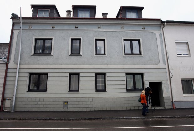 AMSTETTEN, AUSTRIA - MARCH 15: Journalists stand in front of the house, where Josef Fritzl imprisoned his daughter in a cellar for 24 years and fathered seven children with her, on March 15, 2009 in Amstetten, Austria.The 73-year-old Austrian goes on trial on March 16. (Photo by Miguel Villagran/Getty Images)