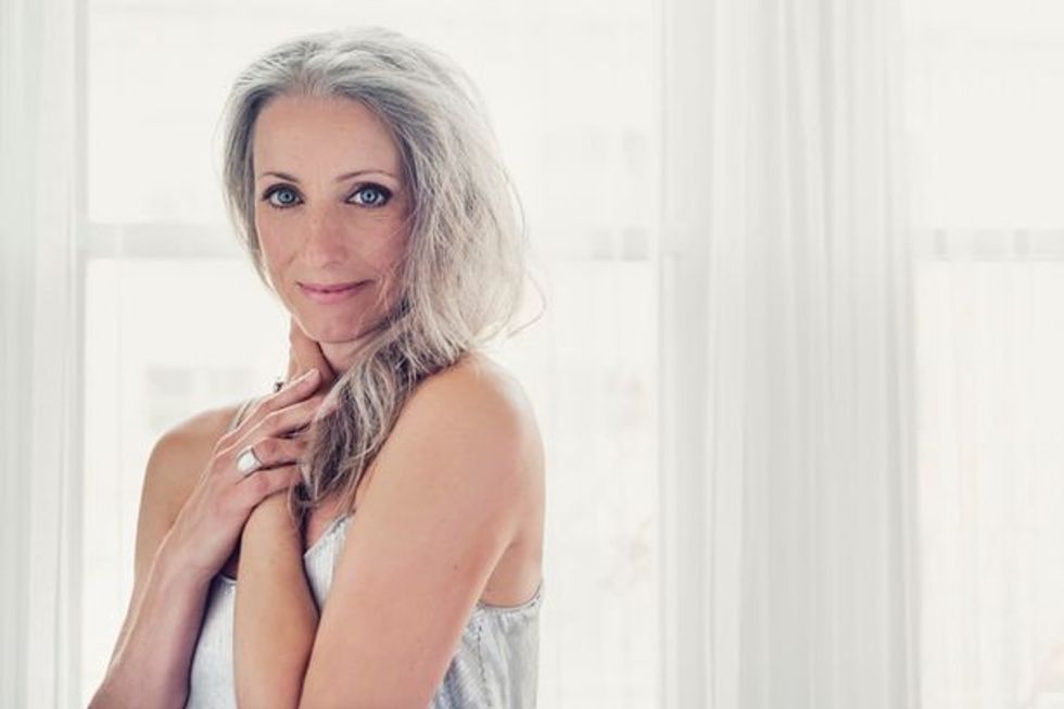 0 Aging gracefully beautiful mature woman with silver hair and dress