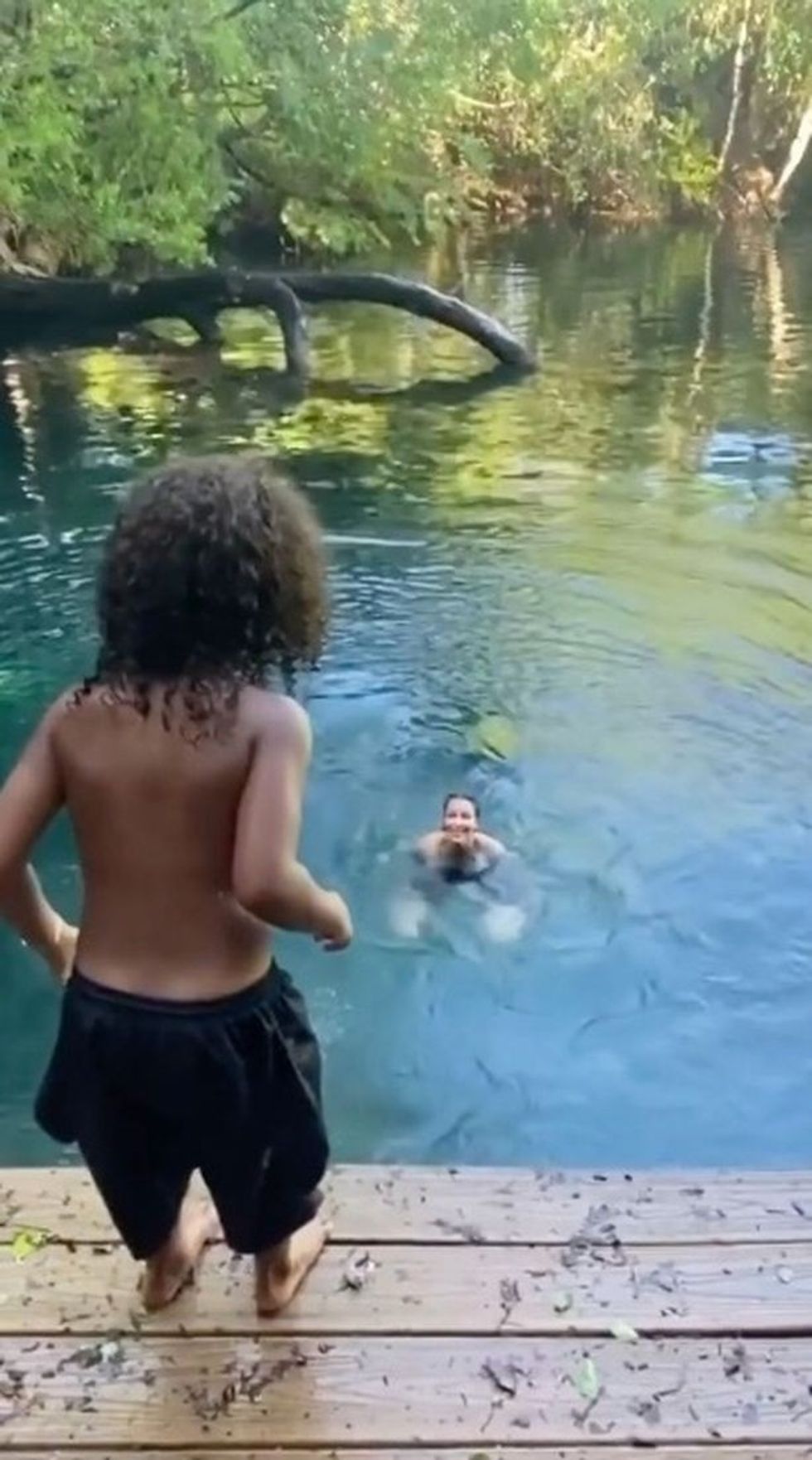 0 Kim Kardashian shows off figure in tiny bikini as she dives into lagoon with her kids 2