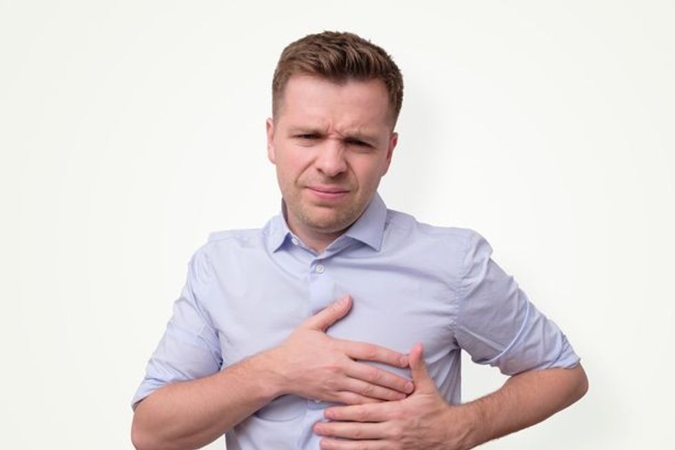 0 man feeling having heart attack symptom or breast cancer