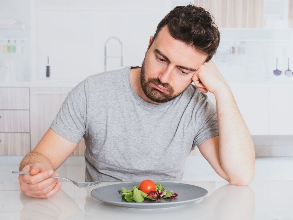0 Sad man diet ready to eat salad for weight loss