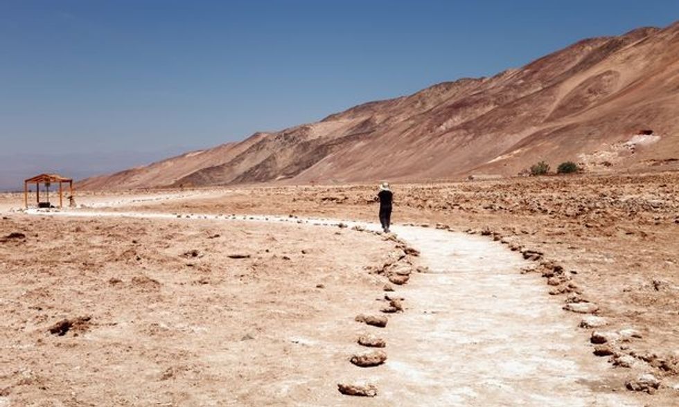 0 Tourist touring the geoglyphs Pintados Cerros near the town of Pica in the commune of Pozo Almonte