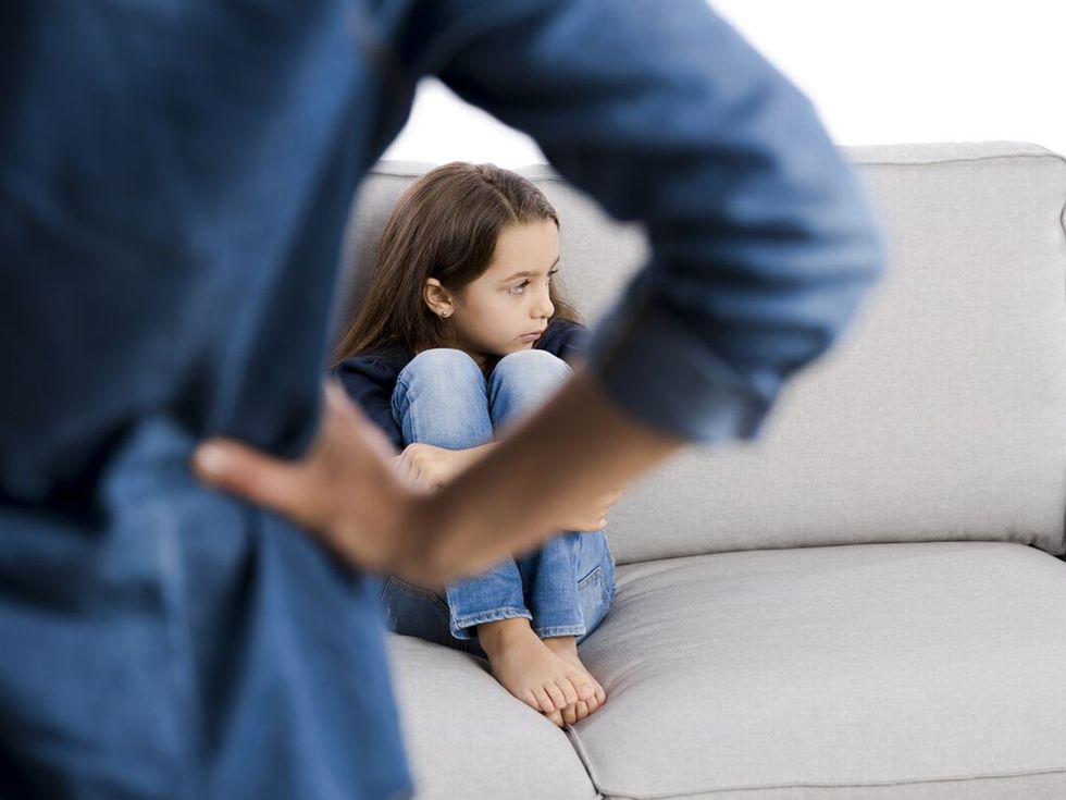 1 Grown up rebuking a little child for bad behavior