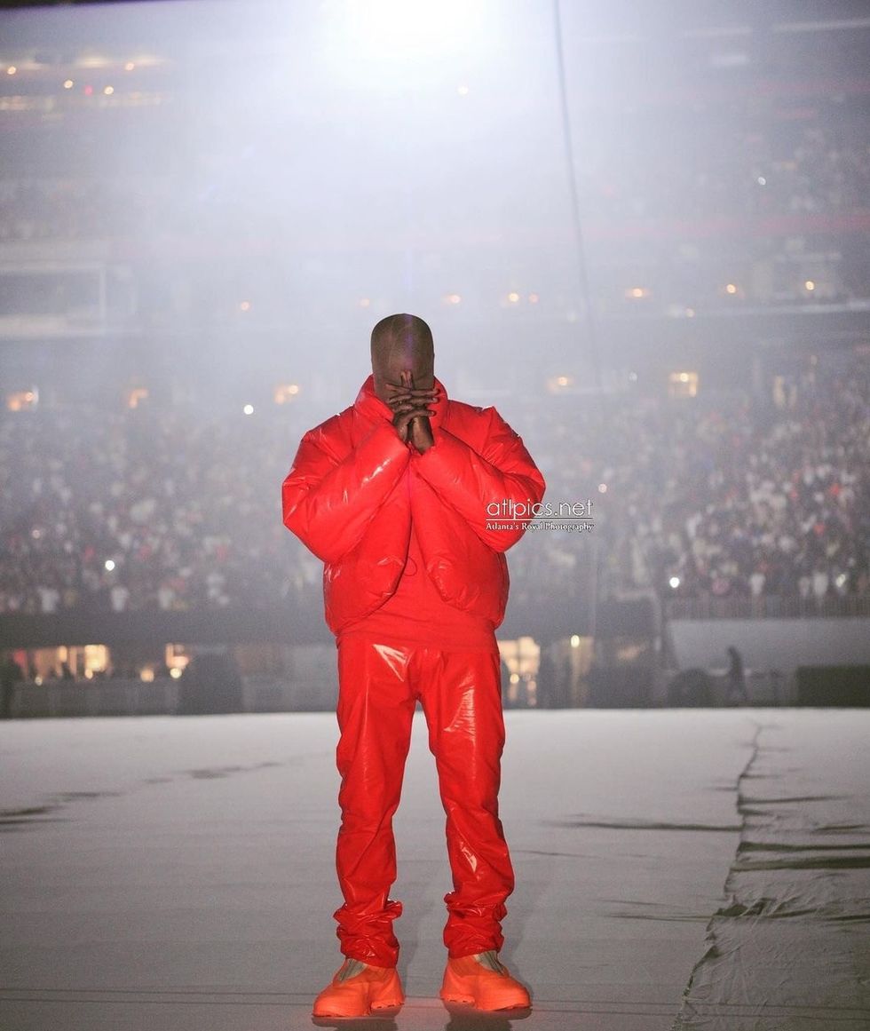 1 Kanye West Debuts Donda Album in All Red Yeezy x Gap Look Kim and Khloe Kardashian Attend in Rick Owens