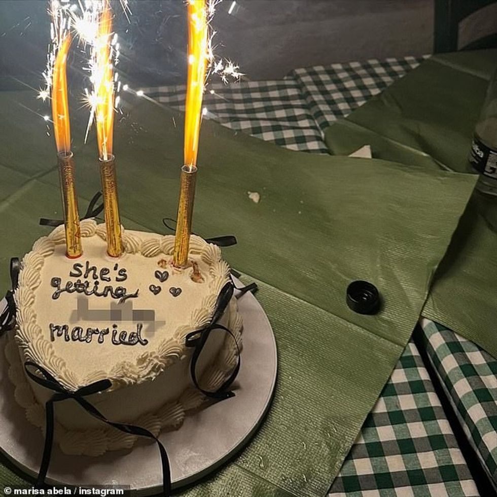 101455385 15023985 In one snap Marisa beamed as she was playfully fed pasta before a 35 1755845942346