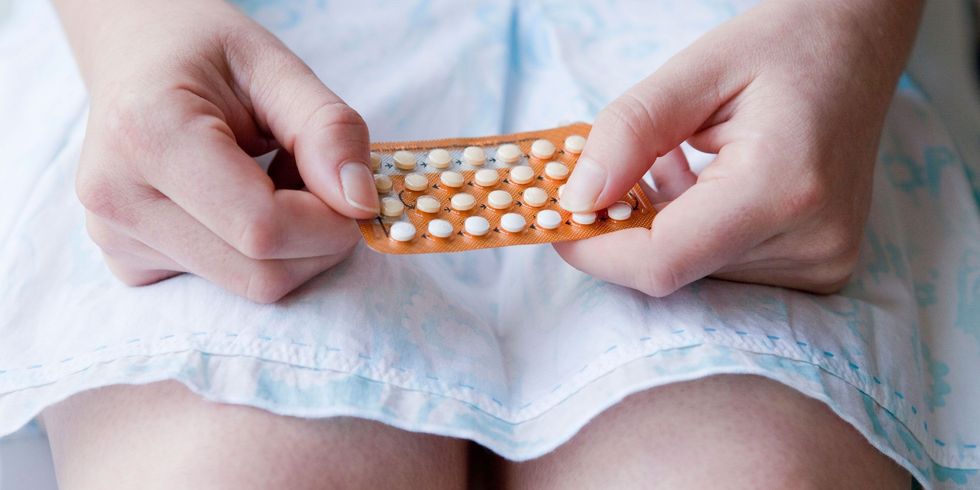 1469099725 woman taking contraceptive pill scaled