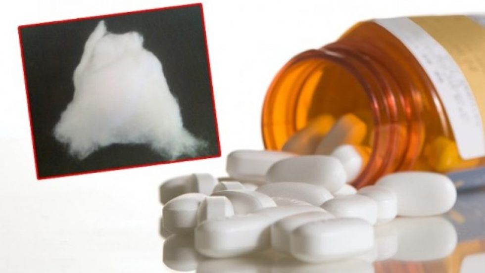 15258 pills spilling out of a m