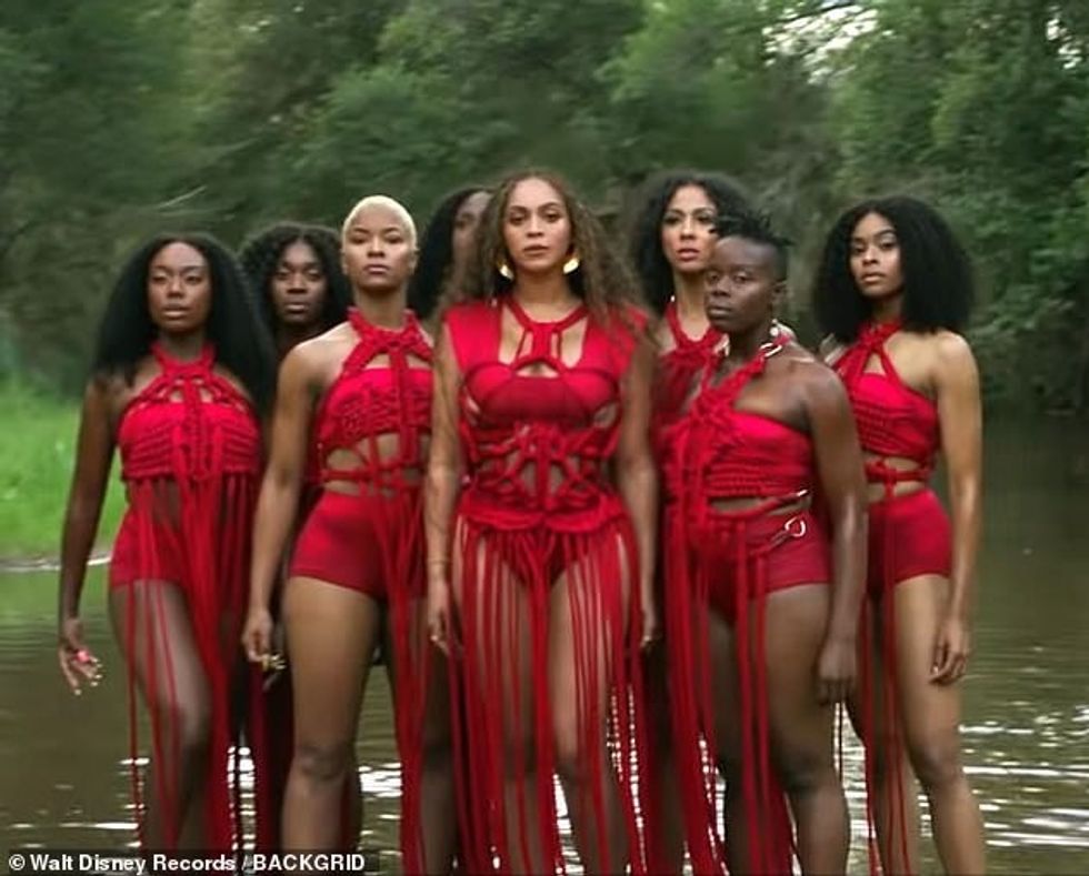 16149936 7255611 Regal Mrs Jay Z also waded in a river while decked out in a reve a 2 1563370109179