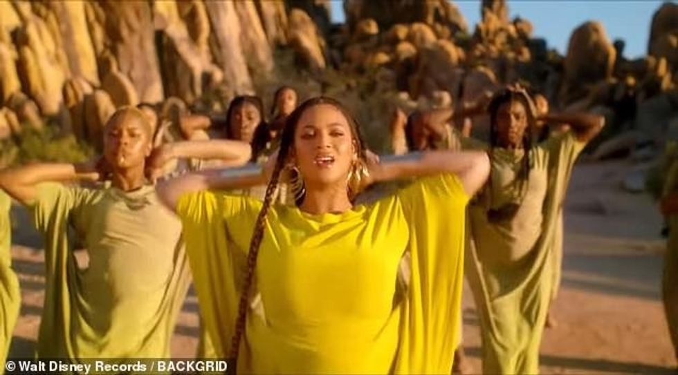 16149996 7255611 A place in the sun She gathered her hair into a pair of braids a a 5 1563370109253