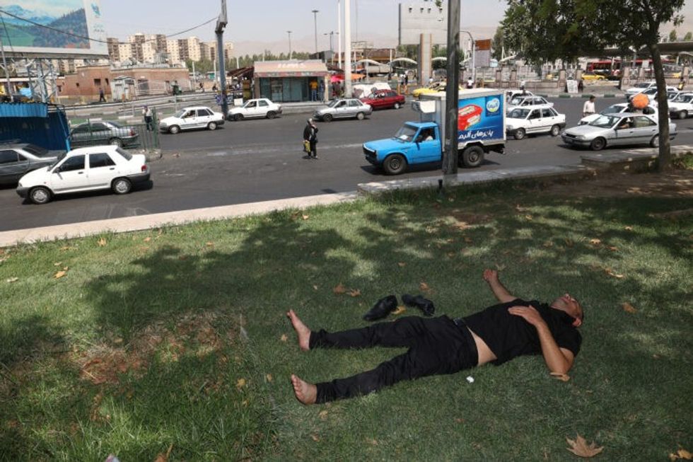 1690983792 2023 08 02T121044Z 897662077 RC2MF2ACOXSA RTRMADP 3 MIDEAST WEATHER IRAN 1