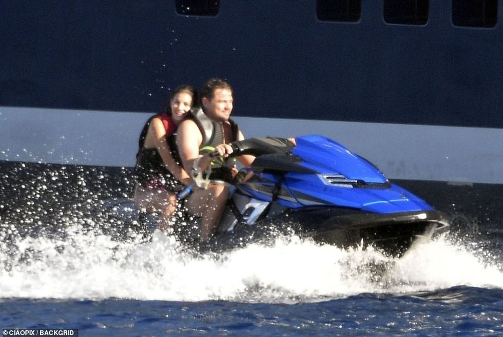 17202622 7350457 Loved up Leonardo and Camilla smiled as they sped around the wat a 21 1565674132466