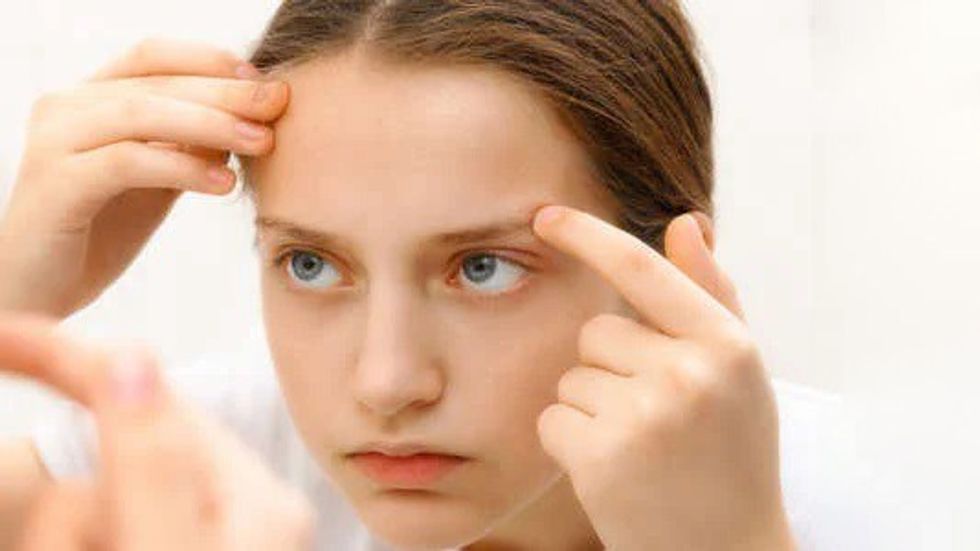 179507997 face of teenage girl she looks at her