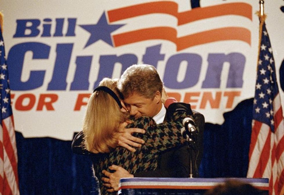 1992 Democratic presidential candidate Bill Clinton hugs his wife Hillary after she introduced him to well wishers at a downtown Chicago hotel, March 10, 1992. (AP Photo/Ralf-Finn Hestoft)