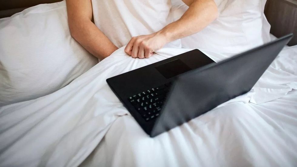 2 Young man sit in bed early