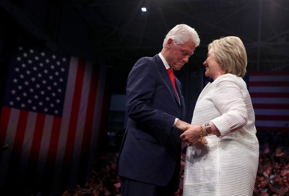 2016 BROOKLYN, NY - JUNE 07: Democratic presidential candidate former Secretary of State Hillary Clinton (R) and her husband former U.S. president Bill Clinton embrace during a primary night event on June 7, 2016 in Brooklyn, New York. Hillary Clinton surpassed the number of delegates needed to become the democratic nominee over rival Bernie Sanders with a win in the New Jersey presidential primary (Photo by Justin Sullivan/Getty Images)