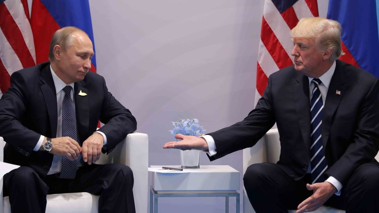 2017/11/putin-trump-handshake-rtr-img-1-e1499461565415.jpg
