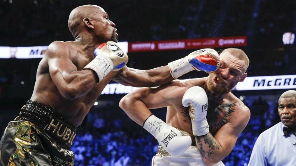 2018/03/floyd-mayweather-punches-conor-mcgregor_u41m9qkx5yr31ke399yvhyhn8.jpg