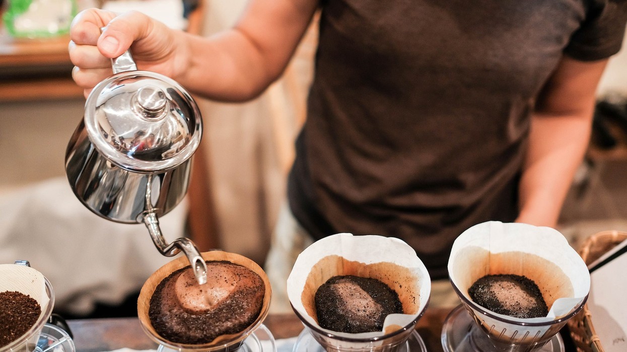2018/04/brewing-black-coffee-pour-over-cup-barista-shutterstock473186929.jpg