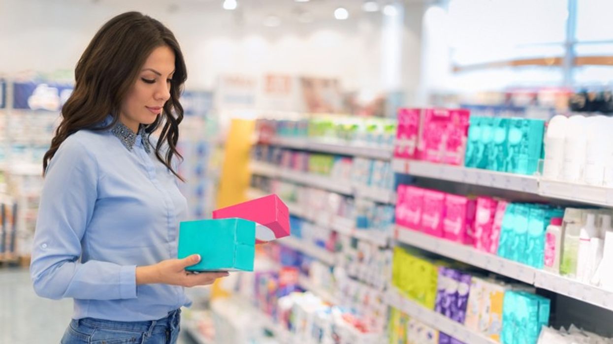 2018/12/1538547703-Woman-shops-for-tampons.jpg