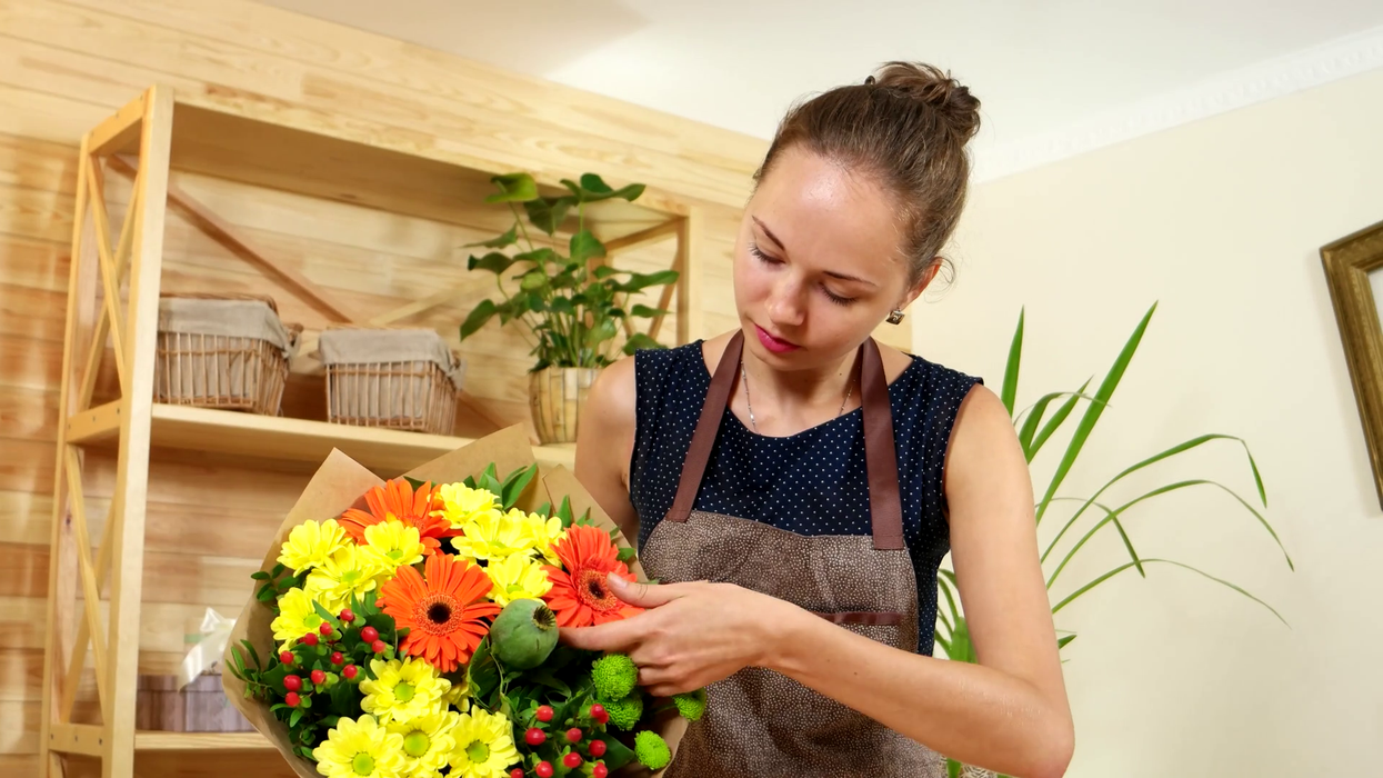 2019/08/florist-girl-works-on-the-order-flower-shop-many-beautiful-flowers-in-the-bouquet-makes-a-festive-bouquet-f.png