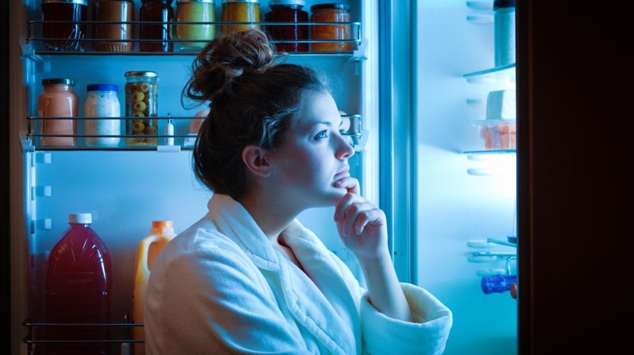 2020/02/woman-contemplating-late-night-snack.jpg