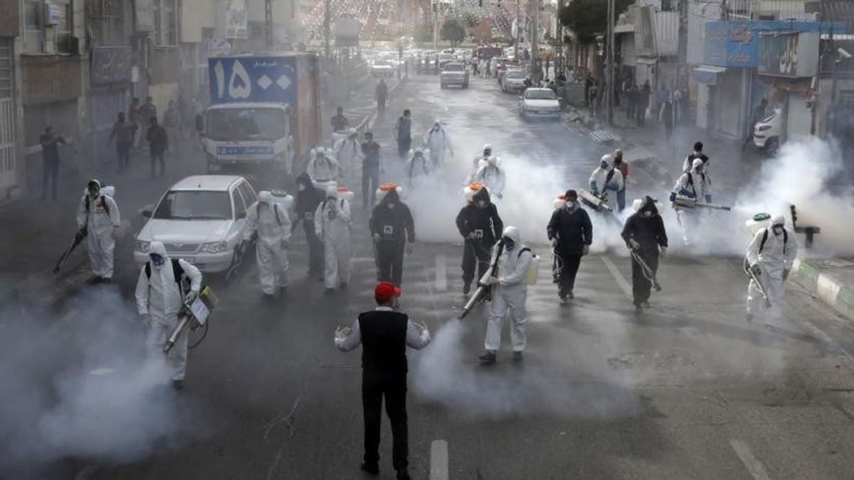 2020/06/iranian_firefighters_disinfect_streets_in_a_bid_to_halt_the_spread_of_coronavirus_in_tehran_on_march_13._afp.jpg