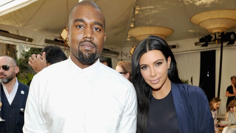 2021/01/kanye-west-kim-kardashian-gettyimages-493498840-e1610395638468.jpg