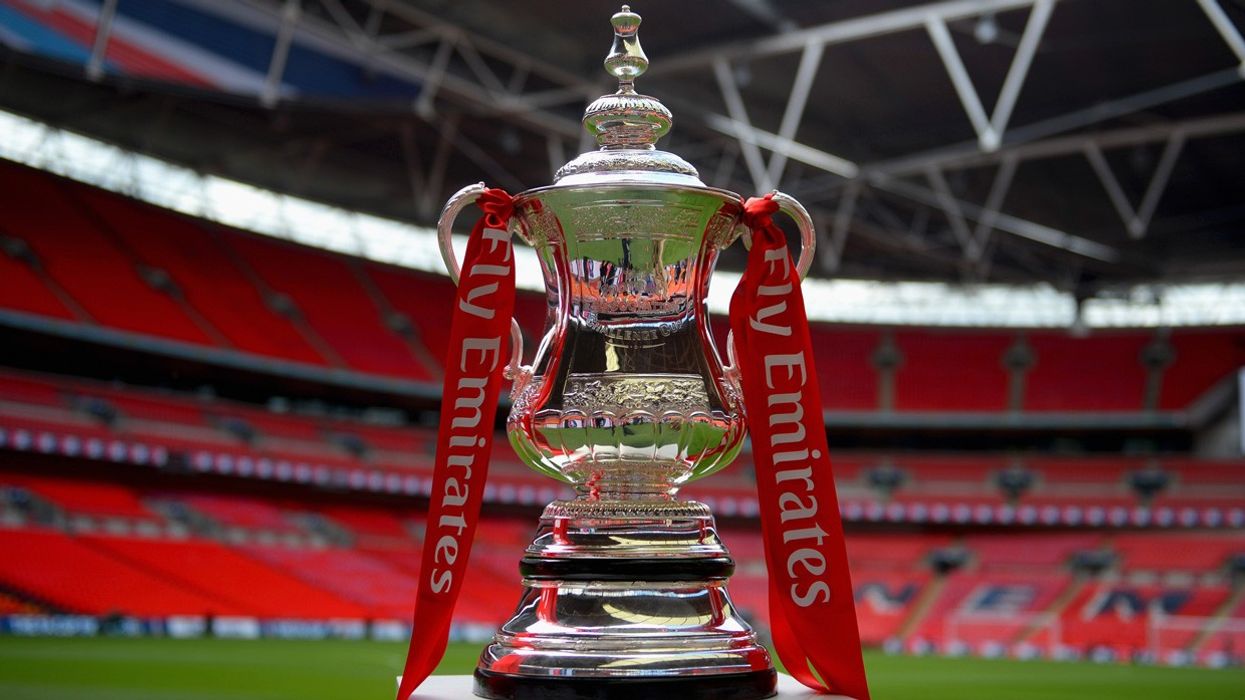 2021/02/emirates-fa-cup-on-stand-on-pitch.jpg