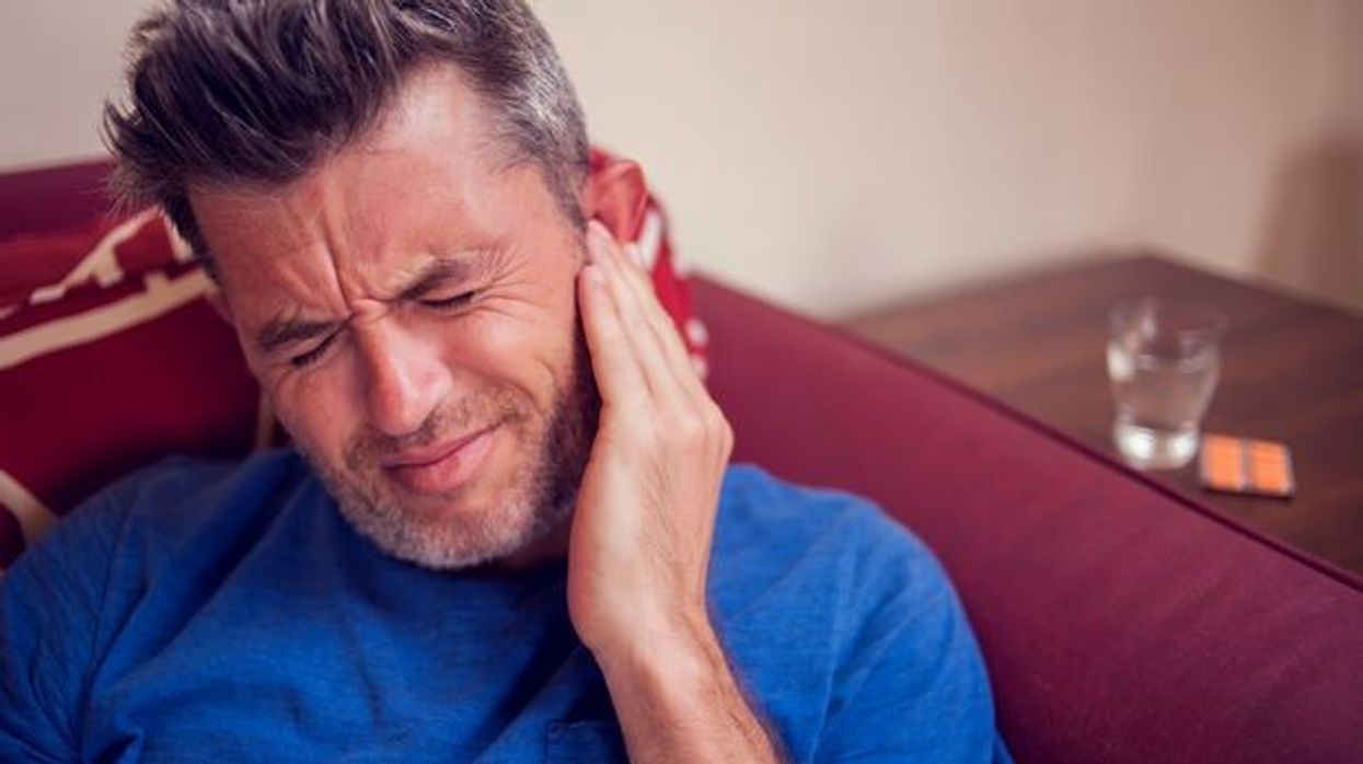 2022/05/0_Man-feels-strong-ear-pain-People-healthcare-and-medicine-concept.jpg
