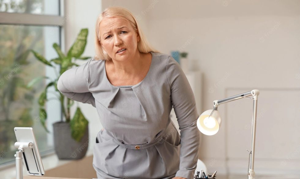 2022/06/mature-woman-suffering-from-back-pain-office_392895-8903_edited.jpg