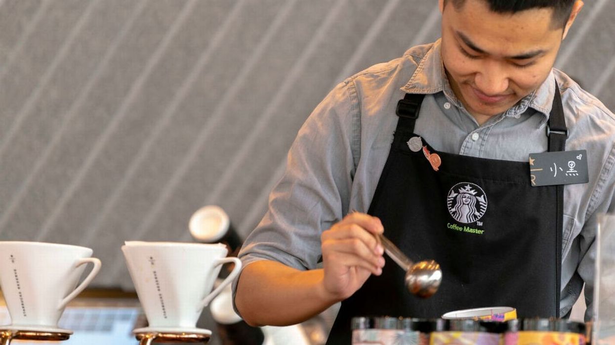 2022/09/0_Barista-is-making-coffee-in-a-new-Starbucks-Reserve-coffee.jpg