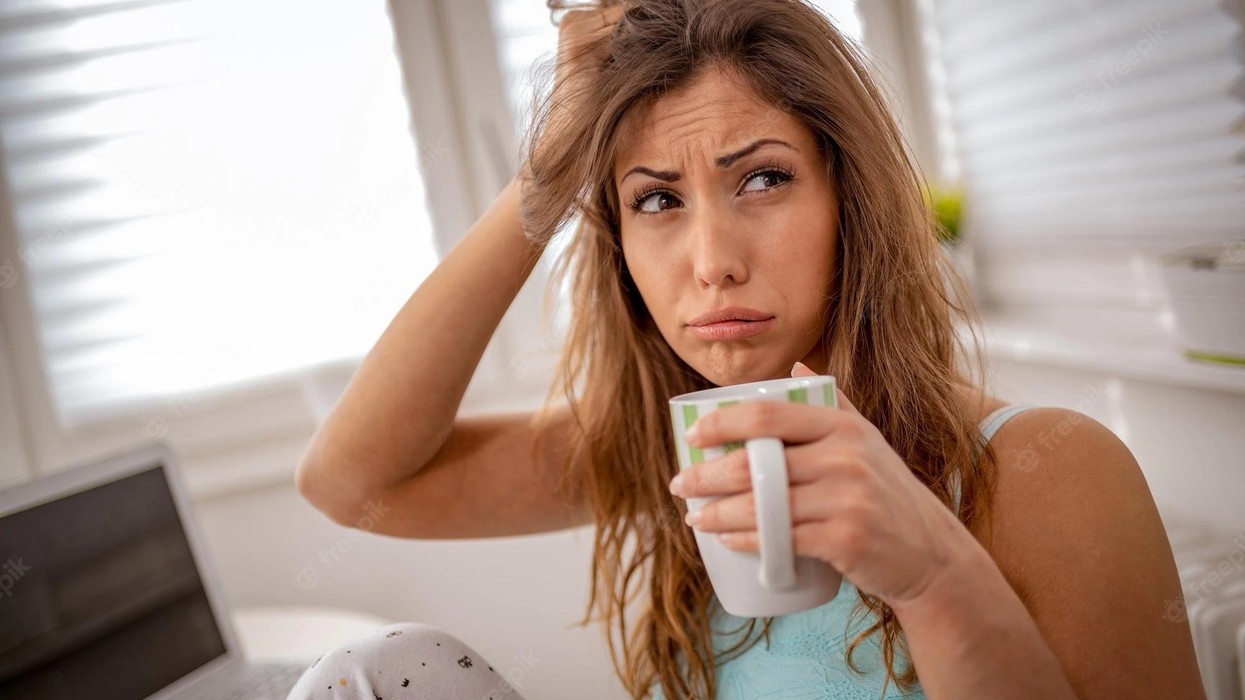 2022/11/beautiful-young-tired-woman-drinking-coffee-morning-can-t-wake-up_360066-3644.jpg