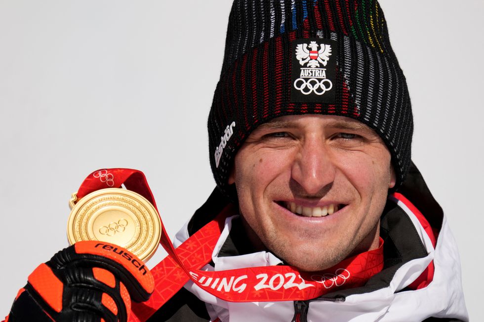 2022 Beijing Olympics - Victory Ceremony - Alpine Skiing - Men's Super-G - National Alpine Skiing Centre, Yanqing district, Beijing, China - February 8, 2022. Gold medallist Matthias Mayer of Austria poses with his medal during the victory ceremony. Luca Bruno/Pool via REUTERS