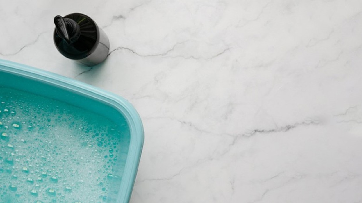 2023/01/bowl-of-soapy-water-and-bottle-of-.jpg