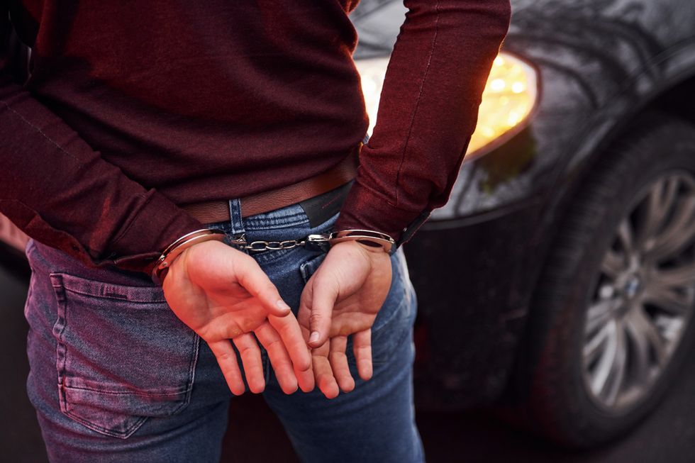 2023/04/woman-standing-in-handcuffs-near-modern-automobile-2021-08-30-12-45-45-utc-3-scaled.jpg