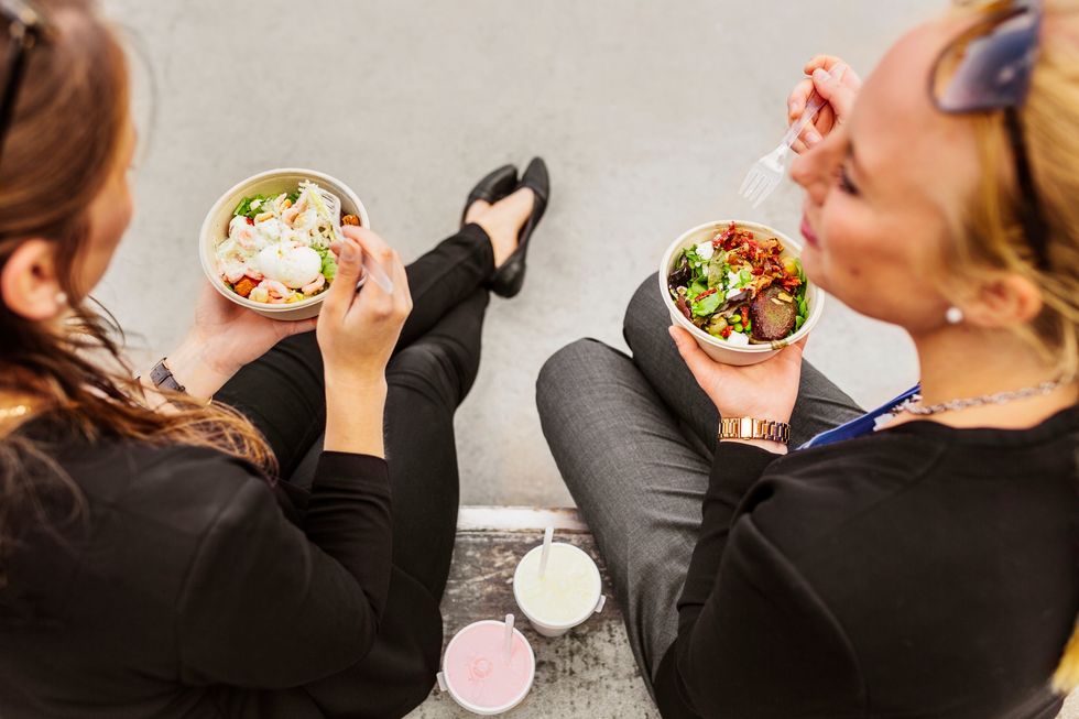 2023/08/high-angle-view-of-two-women-eating-salad-2022-02-02-03-56-37-utc-1-scaled.jpg