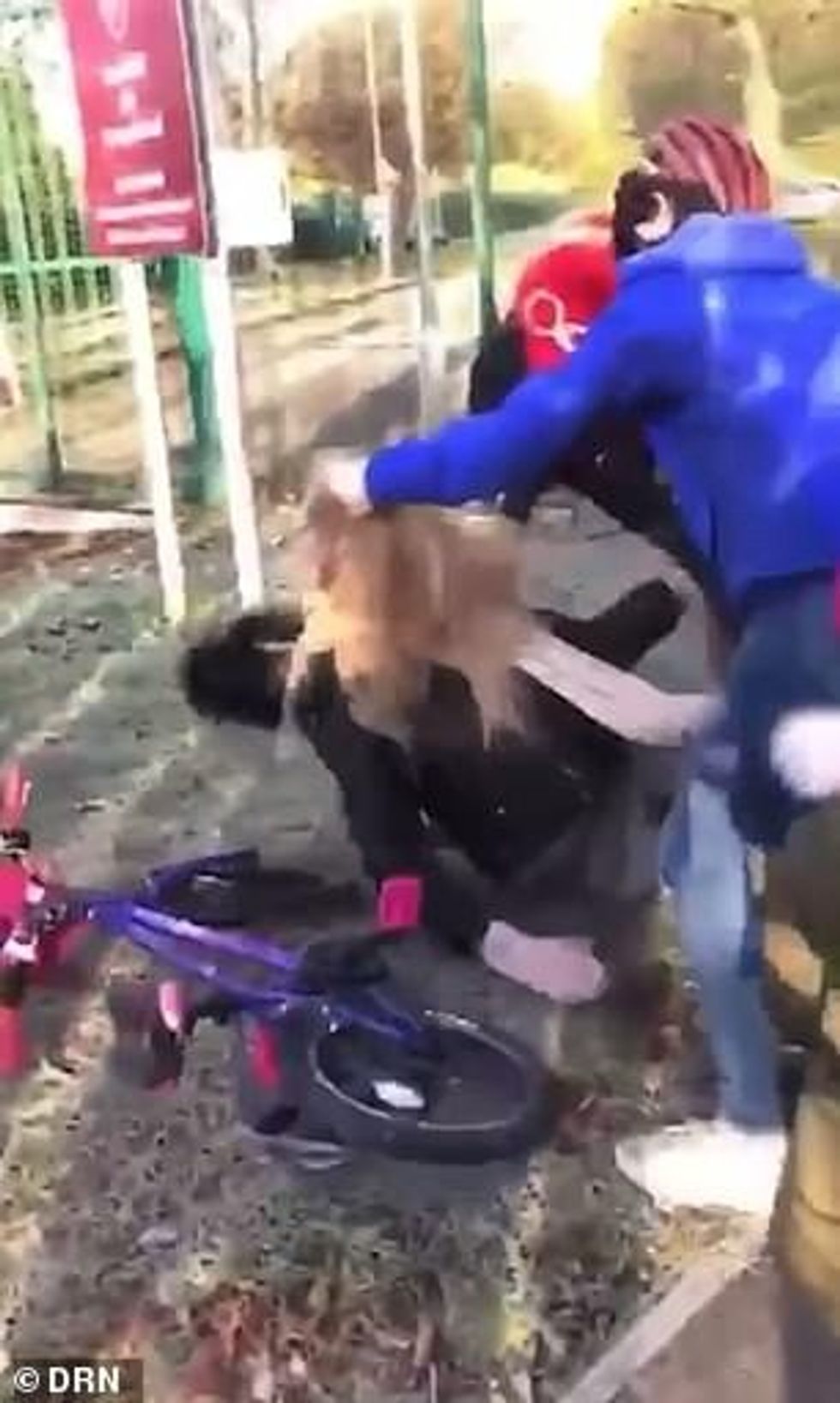 21285066 7709729 One child appears to be knocked off her bike by the brawling pai a 9 1574332442917