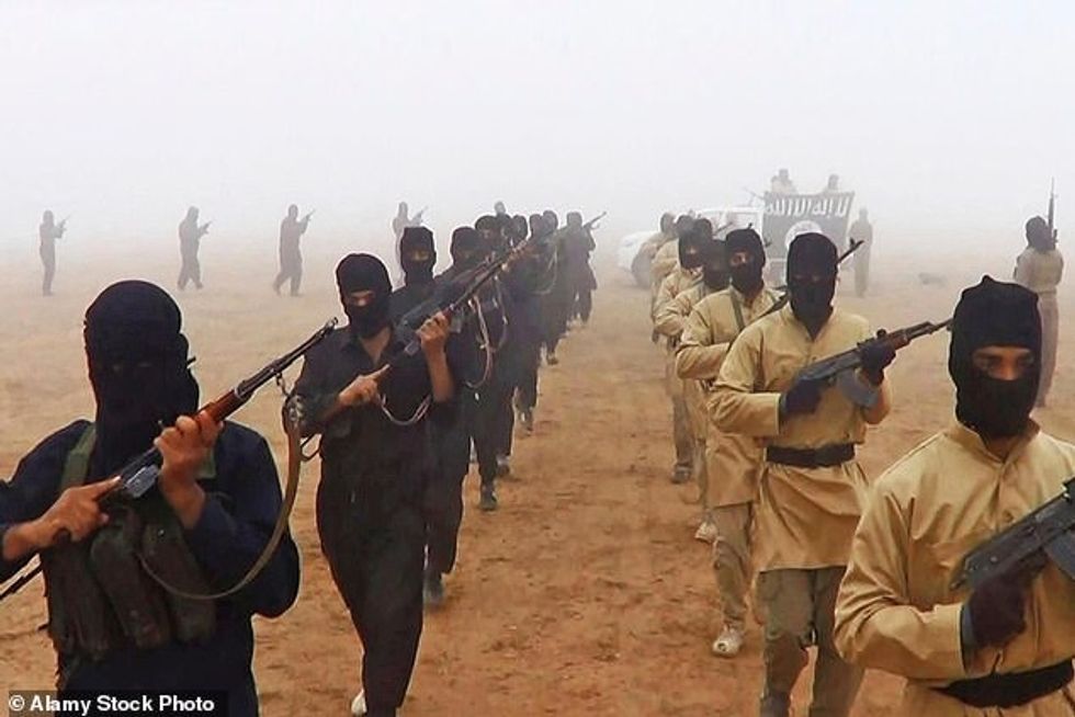 23246314 7874033 Islamic State of Iraq and the Levant fighters march shown in pro a 25 1578677220007