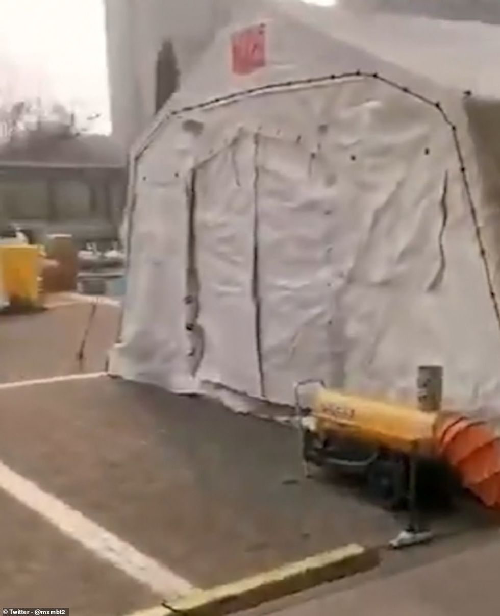 23764758 7919847 Quarantine tents appear to have been set up on the outskirts to a 11 1579778960980
