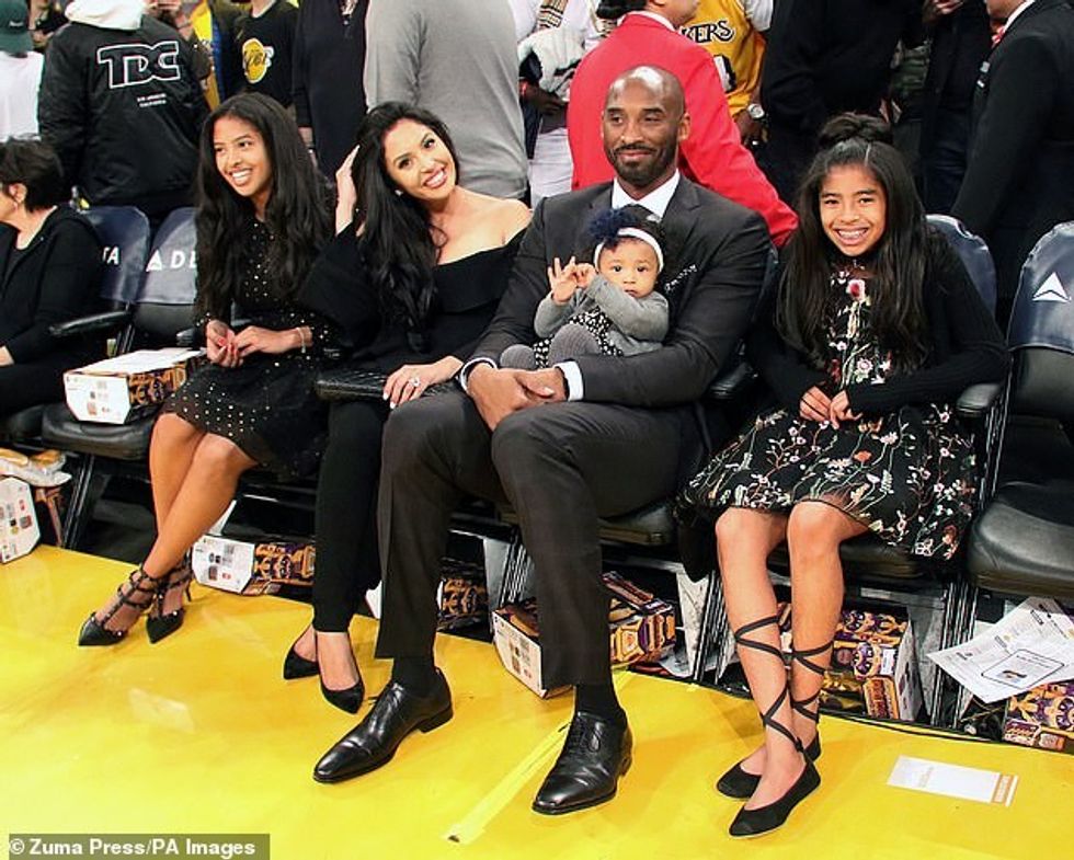 23993564 7939413 Kobe Bryant s grieving wife Vanessa second from left is trying h a 2 1580242102865