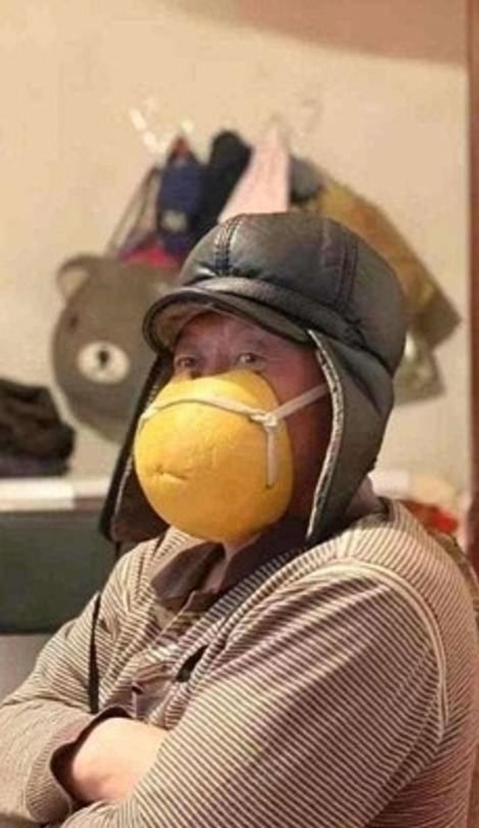 24085434 7947709 A man wearing a mask fashioned out of grapefruit peel a 103 1580396509913