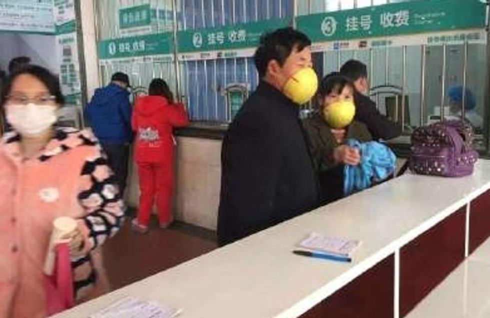 24085558 7947709 A man and young woman in China with what appear to be melon rind a 105 1580396509926