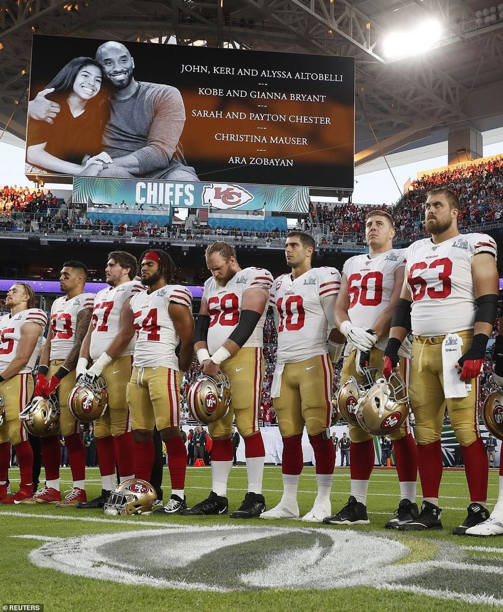 24220996 7959355 The teams line up during the tribute to Kobe Bryant and former M a 5 1580686354129