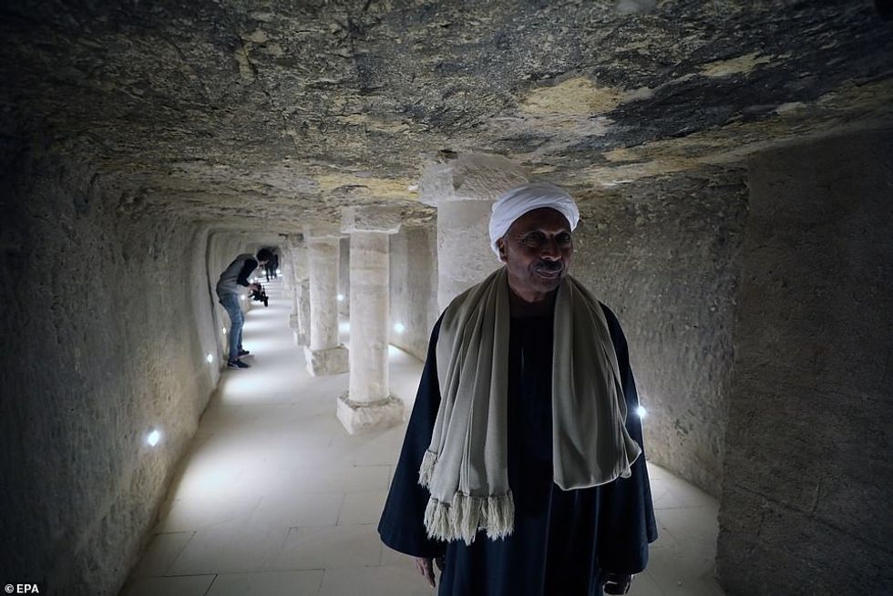 25616938 8079495 Pictured a worker stands inside the entrance to the Burial Chamb a 26 1583492089096