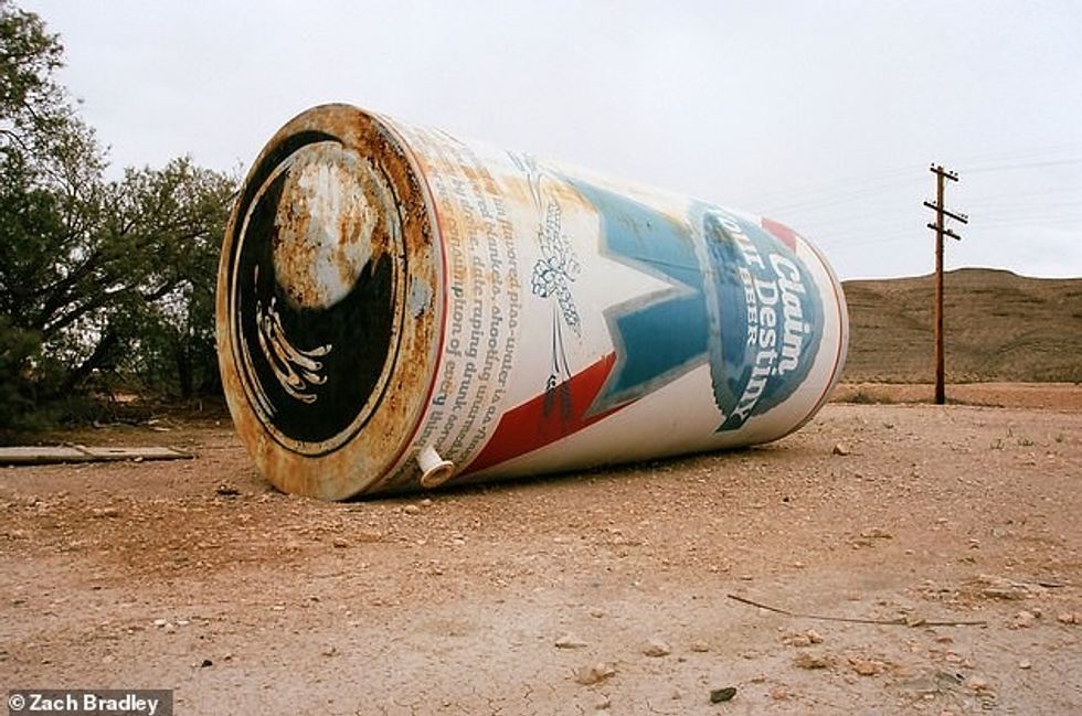 25626970 8083141 An abandoned water tank on the I 15 in Nevada which has been tra a 2 1583761942707
