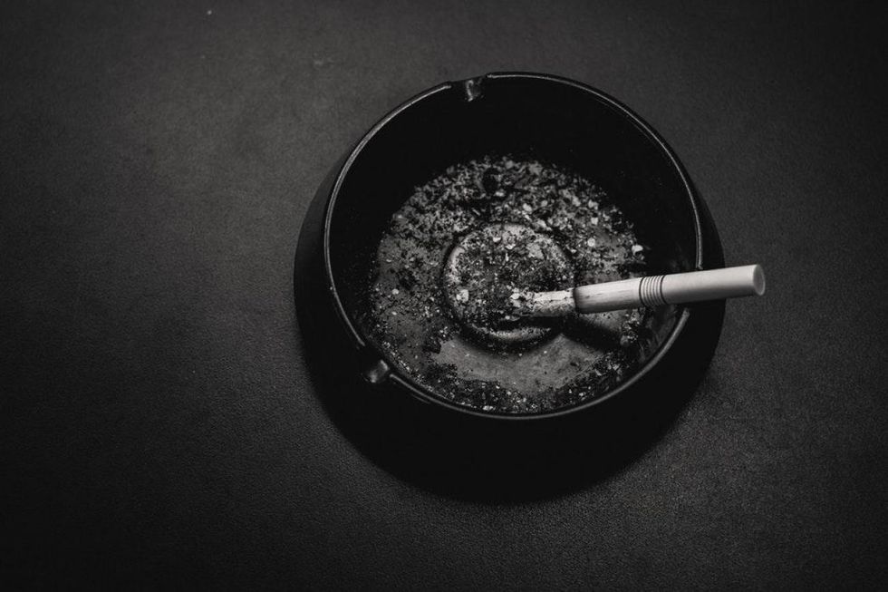 28887065 smiling caucasian woman eating sea fruit with fork isolated on white 1 1