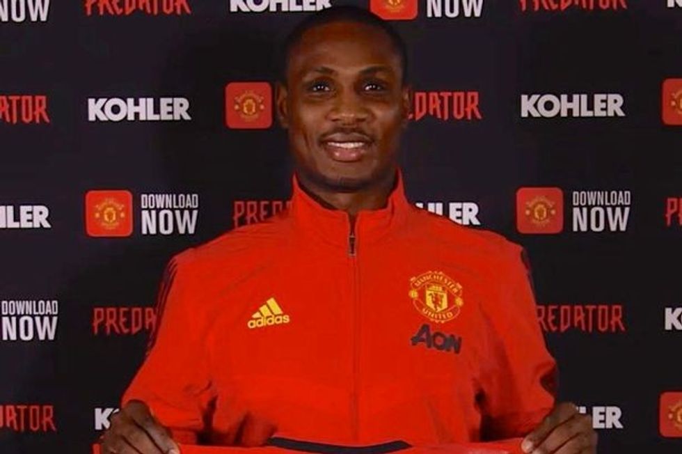 3 New signing Odion Jude Ighalo with Manchester United shirt